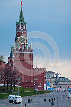 MOSCOW, RUSSIA - APRIL 30, 2018: View of the Spasskaya Tower of the Moscow Kremlin and the Bolshoy Moskvoretsky Bridge. Police bus