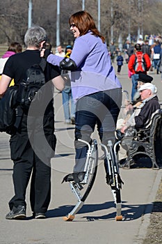 Moscow, Russia - April, 12, 2015: a woman on jumpers in the park