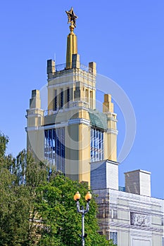 Moscow, Russia - August 01, 2018: Pavilion Grain on VDNH in Moscow against green trees and blue sky on a sunny summer morning