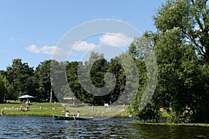 People go boating in the natural-historical park `Kuzminki-Lublino`.