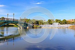 Moscow, Russia - August 12, 2018: View of bridge to the island Horseshoe and light and music fountain from embankment of Middle Ts