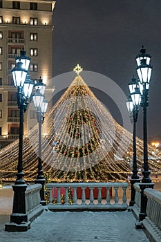 Moscow, Russia - December 7, 2022: Big Christmas tree. New Year decorations and Christmas atmosphere on a winter street in Moscow