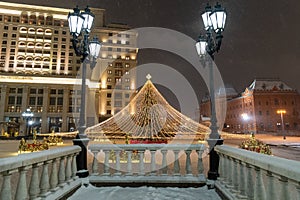 Moscow, Russia - December 7, 2022: Big Christmas tree. New Year decorations and Christmas atmosphere on a winter street in Moscow