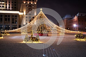 Moscow, Russia - December 7, 2022: Big Christmas tree. New Year decorations and Christmas atmosphere on a winter street in Moscow