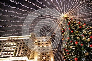 Moscow, Russia - December 7, 2022: Big Christmas tree. New Year decorations and Christmas atmosphere on a winter street in Moscow