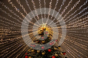 Moscow, Russia - December 7, 2022: Big Christmas tree. New Year decorations and Christmas atmosphere on a winter street in Moscow