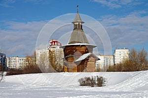 MOSCOW, RUSSIA - February, 2021: Winter day.  Wooden gate-tower of St Nicholas Monastery from Karelia, now at the Kolomenskoe