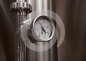MOSCOW, RUSSIA. 07 February 2018: Pressure gauge manometer, valves and pipes made of white metal