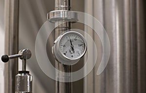 MOSCOW, RUSSIA. 07 February 2018: Pressure gauge manometer, valves and pipes made of white metal