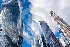 Skyscrapers modern architecture office building with clouds in blue sky, high tech style of