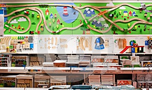 Moscow, Russia, February 2021: The toy department in the Ikea store. Wooden children`s railway with a bridge, roundabout, trees