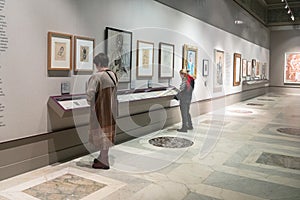 Visitors near stand in Pushkin Museum in Moscow