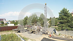 Moscow, Russia - Jule 9 2021: Water Well Drilling Rig, Drill Is Digging A Hole, Holes Boring In Ground With Drilling Rig Machine.