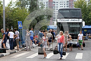 Passengers disembark from an intercity bus at the Krasnogvardeyskaya bus station in Moscow photo