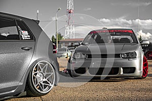 Moscow, Russia - July 19, 2019: Tuned low sport hatchback with red Candy colored alloy wheels. Volkswagen Golf mk 4 is on the