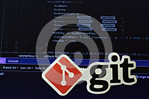 Moscow, Russia - 1 June 2020: Git logo sign with program code on background Illustrative Editorial