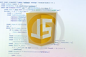 Moscow, Russia - 1 June 2020: JavaScript JS logo sign with program code on background Illustrative Editorial