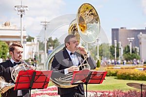 New Life Brass band classical quintet of brass wind musical instruments, orchestra performs music, man musician plays sousaphone,