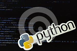 Moscow, Russia - 1 June 2020: Python logo sign with program code on background Illustrative Editorial
