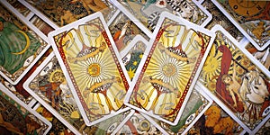 Two tarot cards on the Background of cards