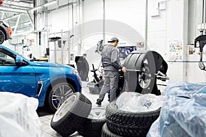 Moscow, Russia, 09.06.2018: Man tire check on balancing machine