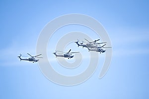 Fighters, flying helicopters at The Victory Day military parade.