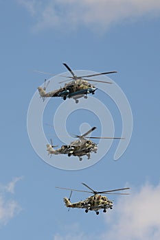 A group of Mi-35M and Mi-24 attack combat helicopters in the sky over Moscow`s Red Square during the dress rehearsal of the Victor photo