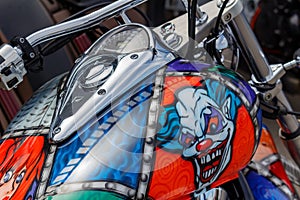 Moscow, Russia - May 04, 2019: Honda motorcycle with airbrushing of evil clown on fuel tank closeup. Moto festival MosMotoFest