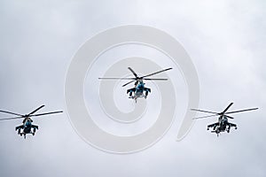 Moscow, Russia - May, 09, 2021: Mi-35M attack helicopters in the sky over Moscow during the parade dedicated to the anniversary of photo
