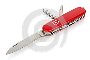 Moscow, Russia - May 15, 2020: Red Victorinox classic swiss pocket foldable knife with open blade, corkscrew and piercer isolated