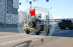 The armored Tigr-M ASN-233115 car of SPN goes on city streets.