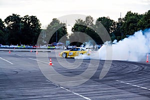 Moscow, Russia - May 25, 2019: Yellow Drift Nissan Silvia. Tuned car drift in the fenced area. Make burnout with a lot  of smoke