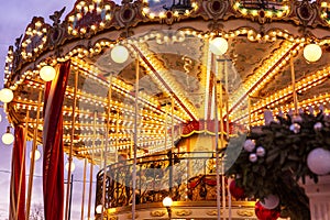 Moscow, Russia, 01/01/2020: New Year`s festive carousel with people rolling and having fun. Close-up