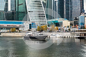 MOSCOW, RUSSIA - OCTOBER 24, 2017: Modern business class pleasure boats next to the wharf of Moscow International Business Centre.