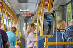 MOSCOW, RUSSIA - SEPTEMBER 14, 2019: The device of fare payment in the bus. The inscription Mosgortrans in Russian.