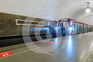 Modern metro train arrival on subway station Park Kultury. Moscow underground