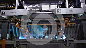 Moscow, Russia - September, 2018: Welding robots movement in car factory. Scene. Movement of robot when welding with