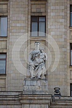 MOSCOW / RUSSIA - 20/04/2019 soviet communist stone sculpture of a sitting mother holding a baby child sculptors Baburin,