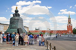 MOSCOW, RUSSIA - 06 14 2016: Tourists in Moscow Kremlin beside the Tsar Bell, a masterpiece of Russian casting