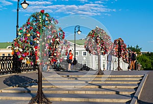 MOSCOW, RUSSIA - 21.09.2015. Trees with locks of lovers on trees at Tretyakovsky bridge