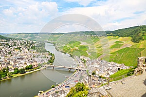 Moselle Valley Germany: View from Landshut Castle to the old town Bernkastel-Kues with vineyards and river Mosel in summer