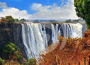 Mosi-o-tunya Victoria Falls with a nice blue cloudy sky in Zimbabwe, Southern Africa