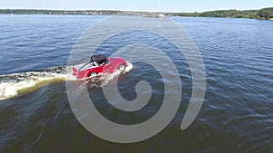 Moskow, Russia - MAY 15, 2018 amphibious vehicle , WaterCar Panther , Red Car , swimming on the river by car