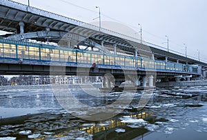 Moskva River, Luzhnetskaya Bridge Metro Bridge on a winter evening. Moscow, Russia