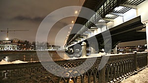 Moskva River, Luzhnetskaya Bridge Metro Bridge on a winter evening. Moscow, Russia