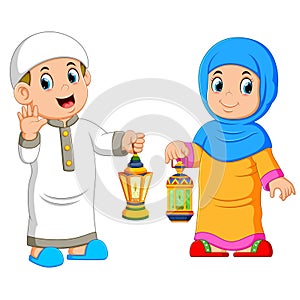 Moslem couple holding lantern photo