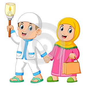 Moslem couples walking and holding torch