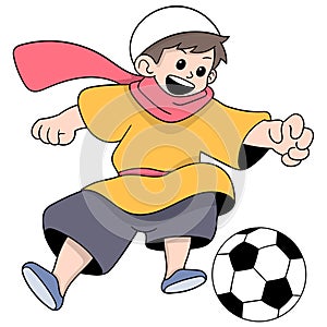 moslem happy boy playing soccer dribbling a ball