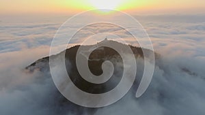 Mosque on clouds over at the mountain peak