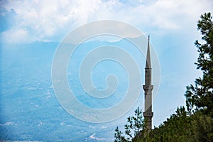 Mosque in a cornfield on a background of mountains. Turkey, Alanya